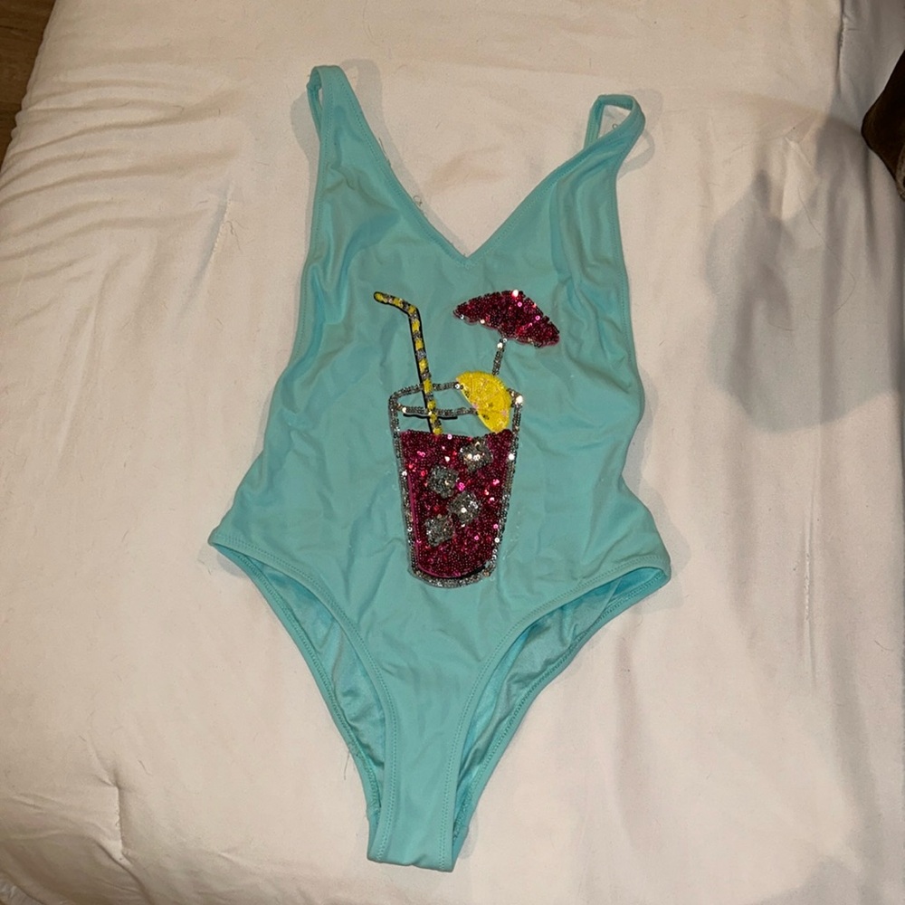 Blue one piece bathing suit with sequins drink on the front